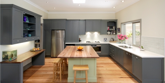 Wood style table top and flooring with grey kitchen cabinets